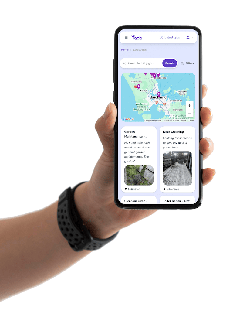 A closeup hand holding phone with Yada odd jobs interface